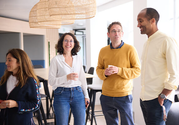 Colleagues discussing business performance and market insights.