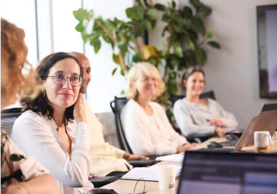 Group discussion in a modern office meeting room.